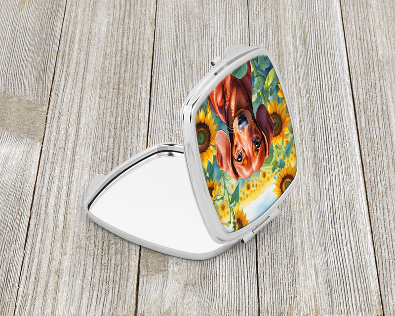 Sunflower compact mirror open, showing red dachshund graphic on inside