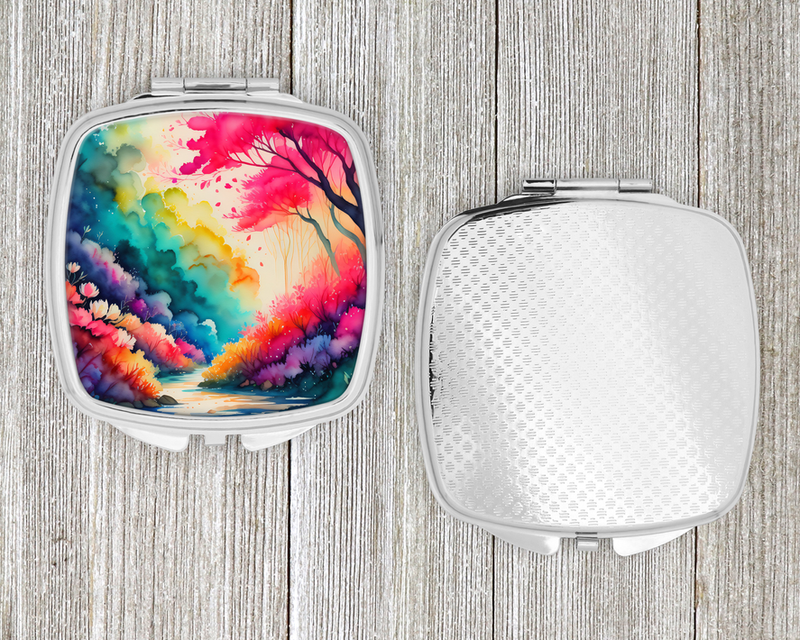 Silver compact mirror with colorful floral landscape cover and textured silver back