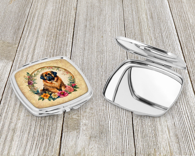 Silver compact mirror open and closed, with dog flower illustration on the case