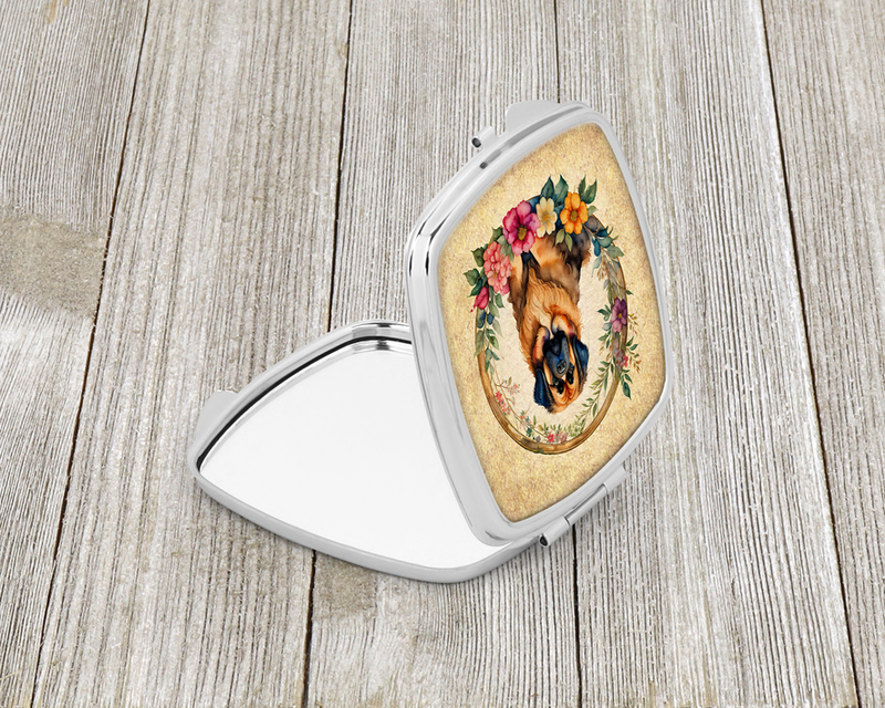 Silver compact mirror with open lid and floral portrait of a Tibetan mastiff