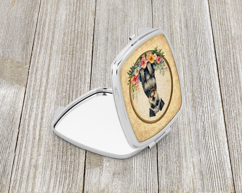 Silver compact mirror with open lid and schnauzer portrait in floral oval