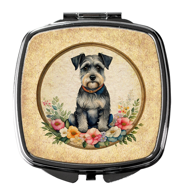 Silver compact mirror with closed lid featuring a schnauzer portrait surrounded by flowers