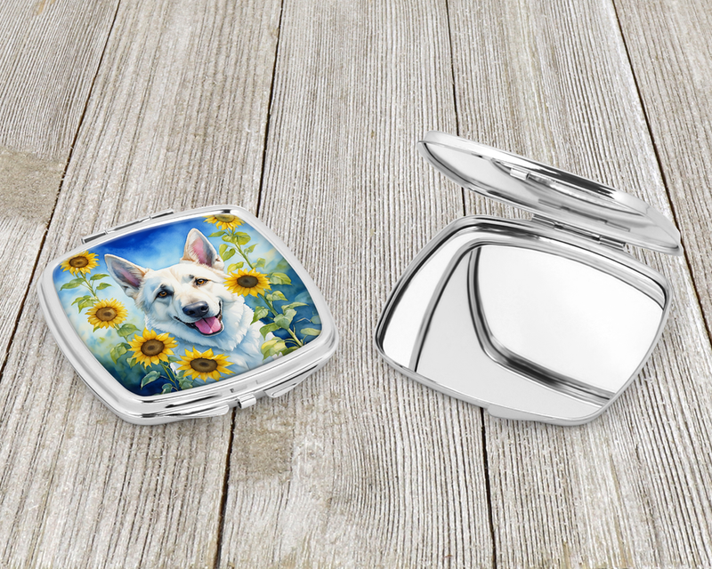 Silver compact mirror open, white dog artwork with sunflowers on the round cover
