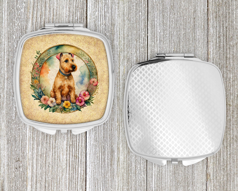 Compact mirror with silver case; terrier floral design on one side, blank on the other