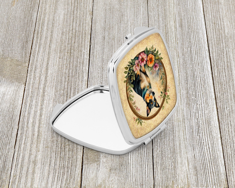 Silver compact mirror with oval dog artwork inset, side cover opened