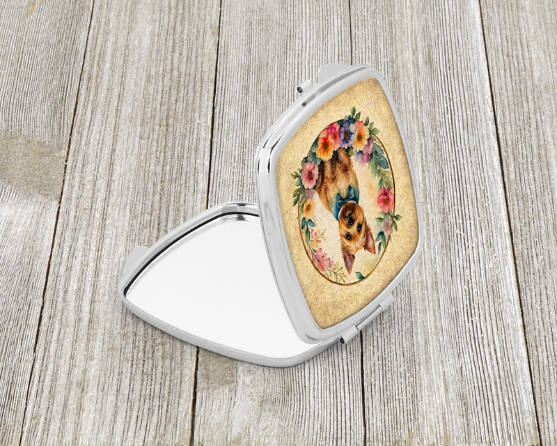 Silver compact mirror with oval terrier portrait in flowers on the open lid
