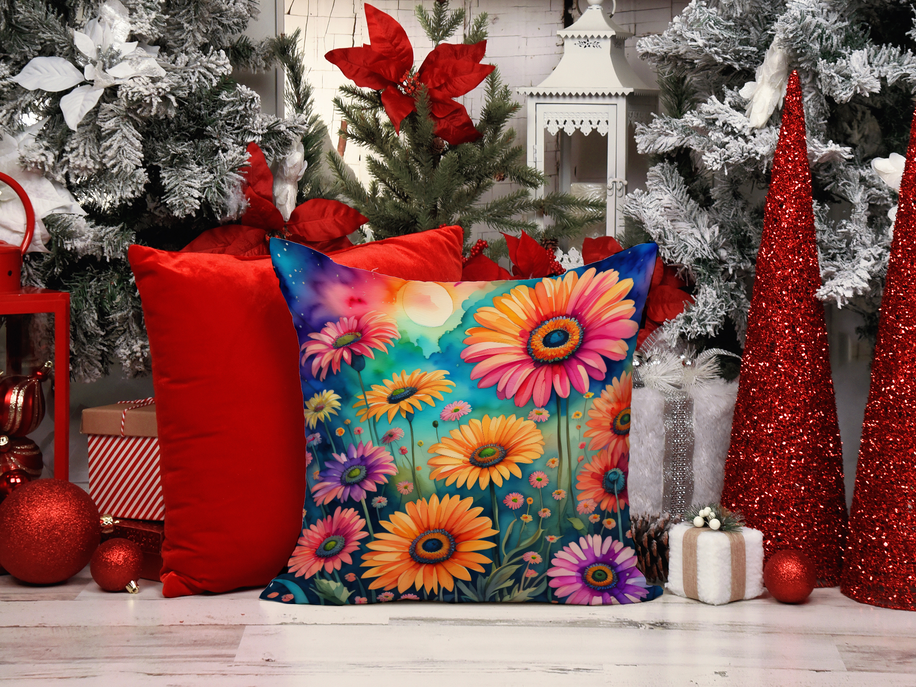 Multicolor flower cushion displayed among holiday decor and red accents