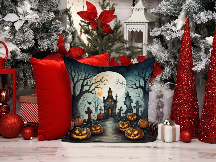Halloween pot holder motif on a decorative pillow with witch, moon, and jack-o-lanterns