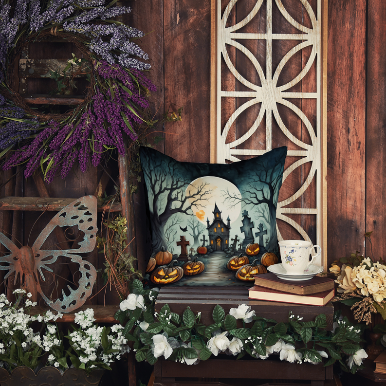 Halloween pot holder design on pillow with flying witch scene, moon, and pumpkins