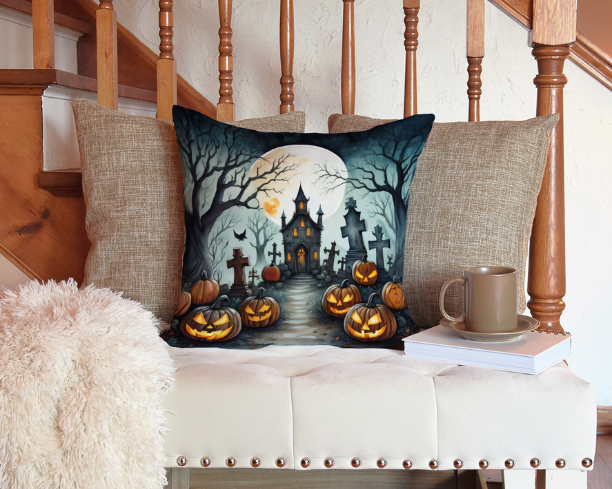 Halloween pot holder artwork on pillow with witch, moon, and jack-o-lantern pumpkins