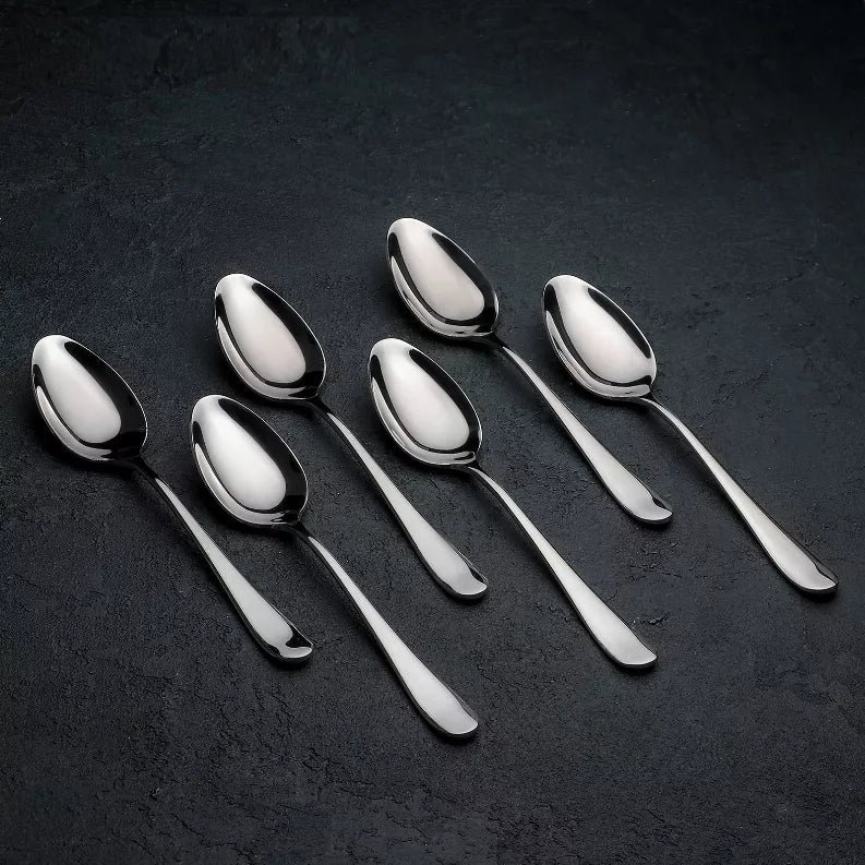 Set of stainless steel dinner spoons with oval bowls and long handles