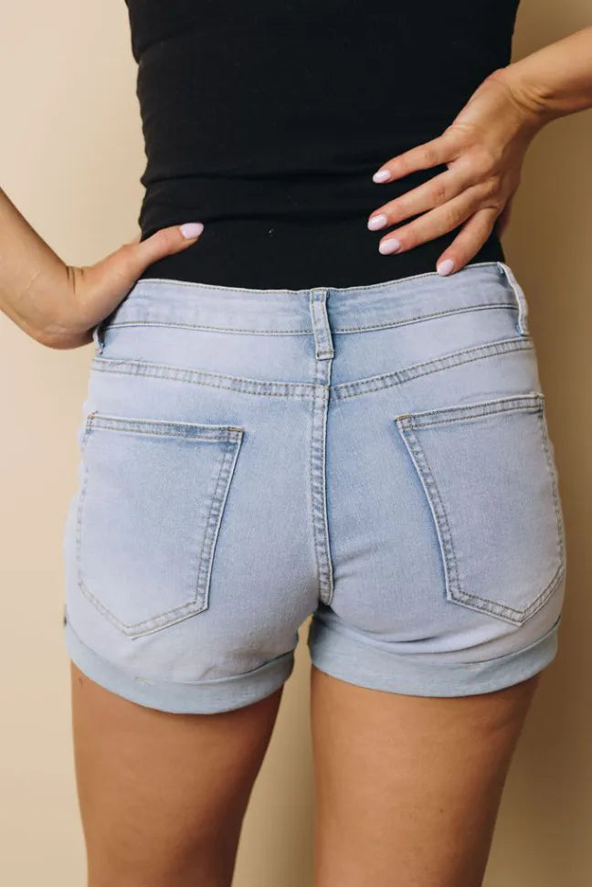Sky blue cuffed denim shorts, front view with pockets and button