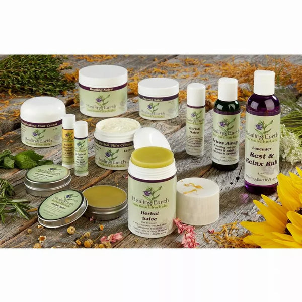 Healing Earth starter display with herbal salves, skin cream, and bottles, white caps