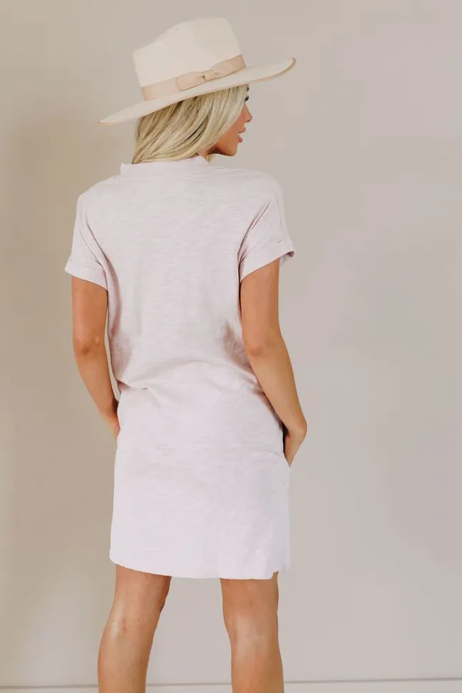 Light pink short-sleeve t-shirt dress with round back neckline, above-knee length