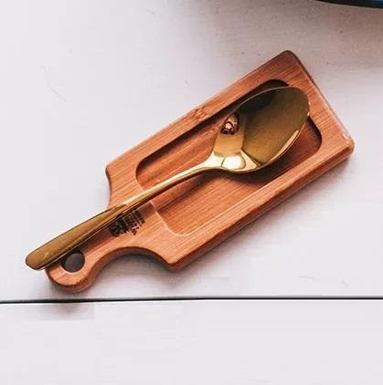 Wooden serving tray with built-in spoon rest groove, rounded end handle hole