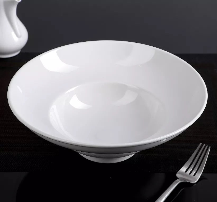 White deep bowl plate with smooth glossy interior and wide rim