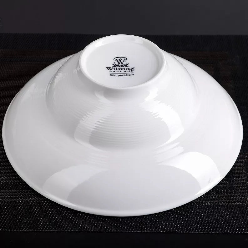 White deep bowl plate with Wimax logo and “fine porcelain” on underside