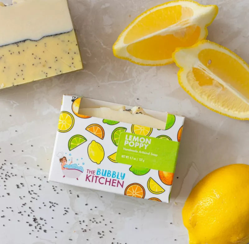 Lemon poppy soap bar in yellow box with lemon and poppy seed graphics