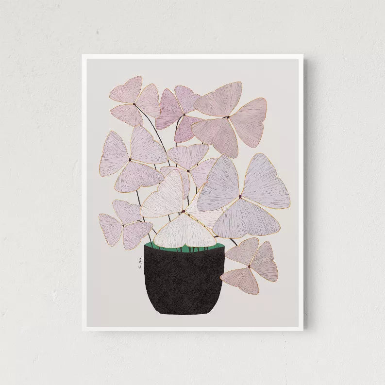 Framed butterfly collage print with lavender petals in a black vase, thin white border