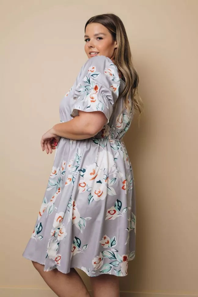 Plus size sky blue floral midi dress, puff sleeves, side view, gathered waist
