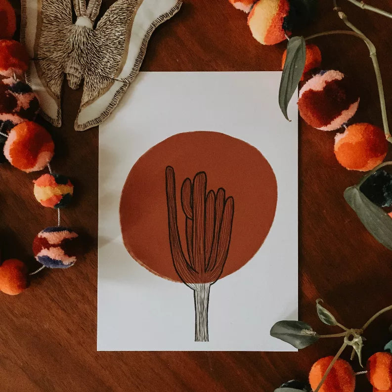 Framed desert plant art print featuring a red-orange circle and black cactus outline