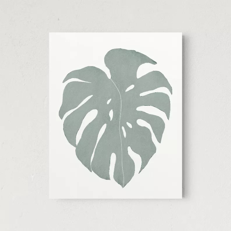 Monstera leaf art print on white paper with soft gray leaf illustration
