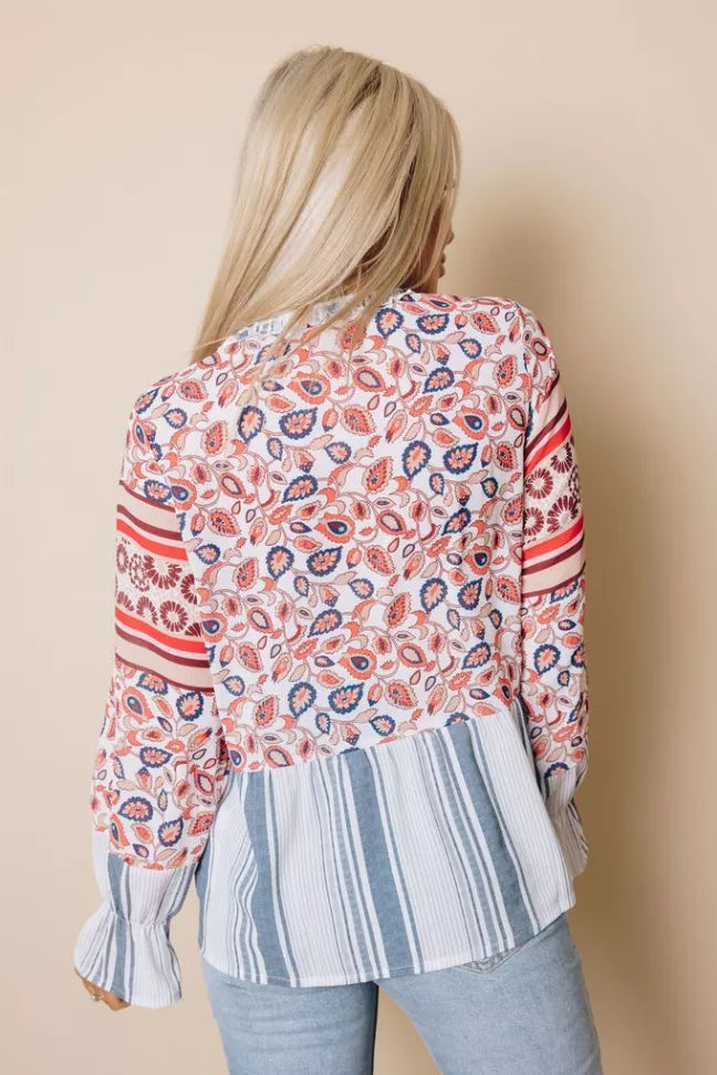 Floral printed blouse with striped lower panel and gathered long sleeves