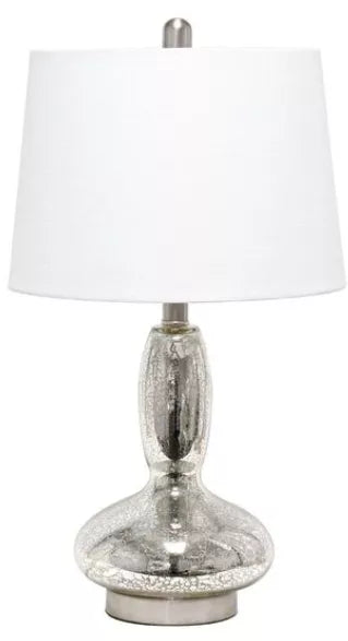 Clear glass table lamp with white fabric drum shade and silver base
