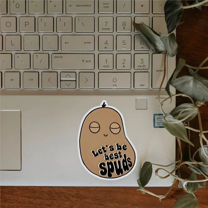 Cartoon potato sticker: 'Let's be best spuds' text, brown face with black outline