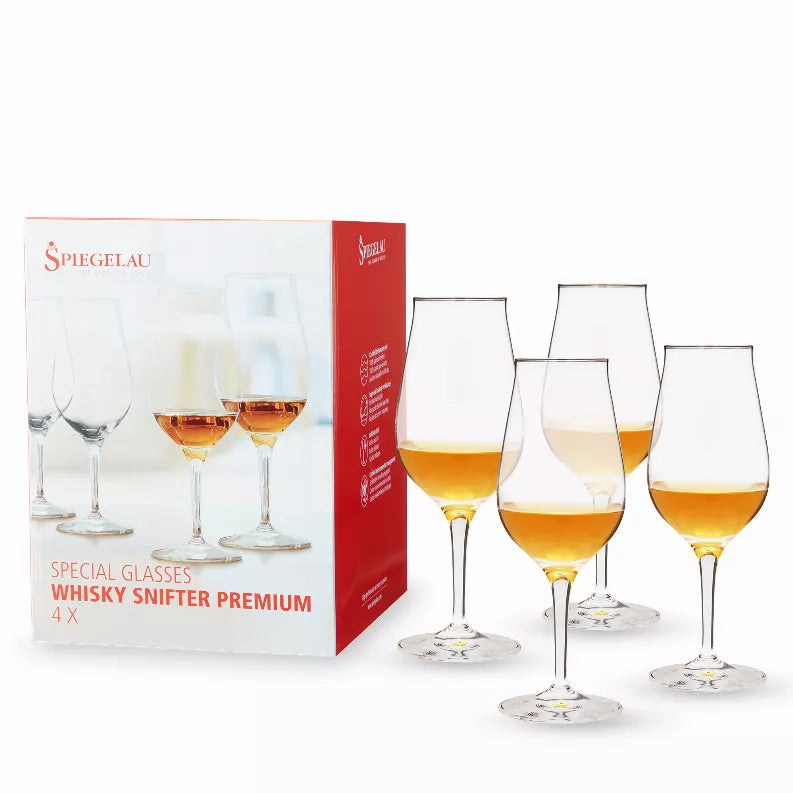Spiegelau whiskey snifter set of four clear glasses with box, filled with amber liquid