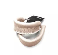 Beige leather hair tie with curved wrap design
