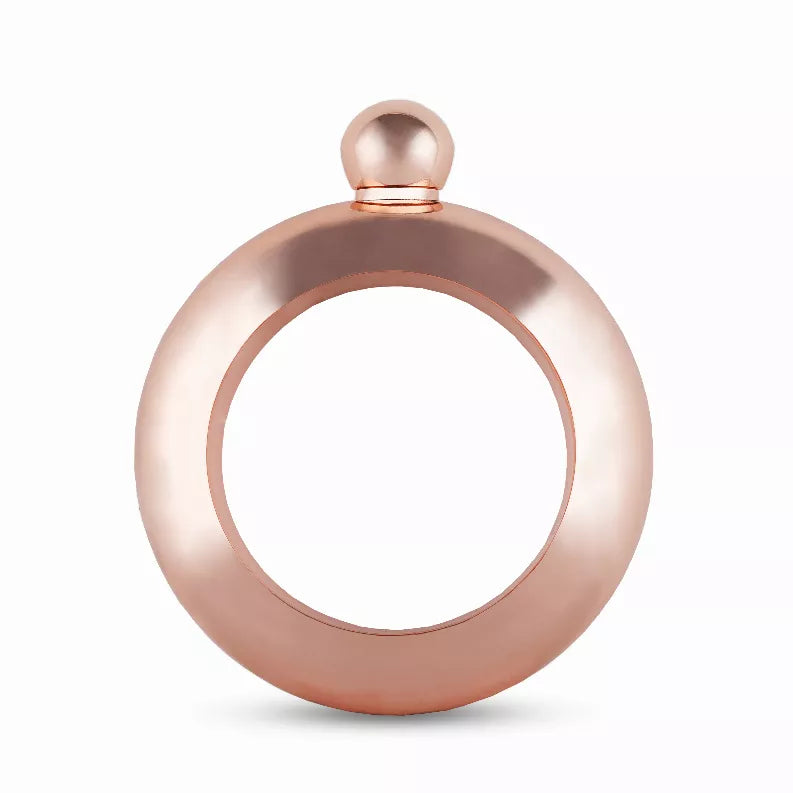 Rose gold bracelet-style flask with circular body and screw-top cap