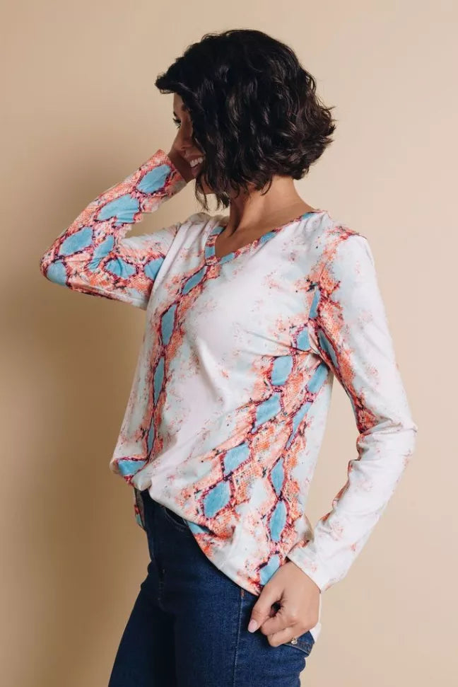 Women’s V-neck long-sleeve snakeskin print top in pink, side view