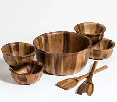 Dark wood salad bowl set with large bowls, serving scoops, and smaller condiment bowls