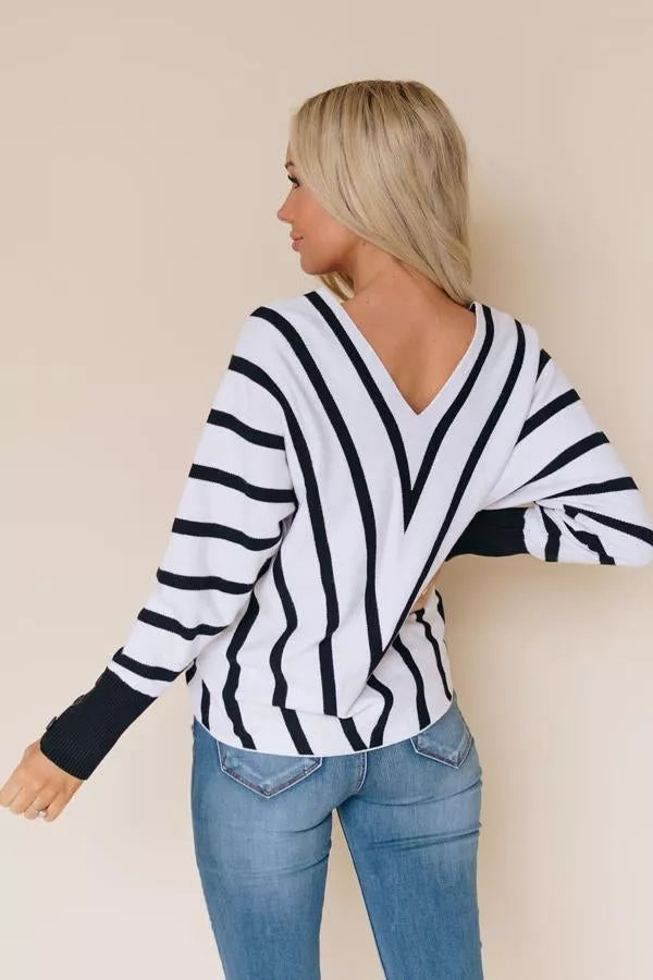 Black and white striped V-neck sweater, side view with long sleeves