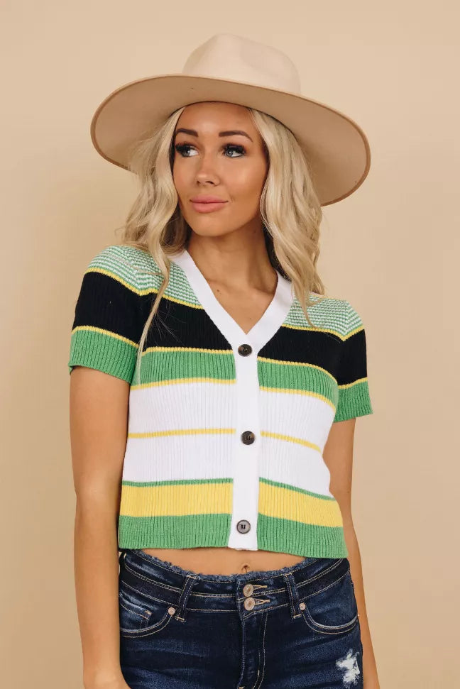 Green colorblock knit crop top with V-neck, short sleeves, and button front
