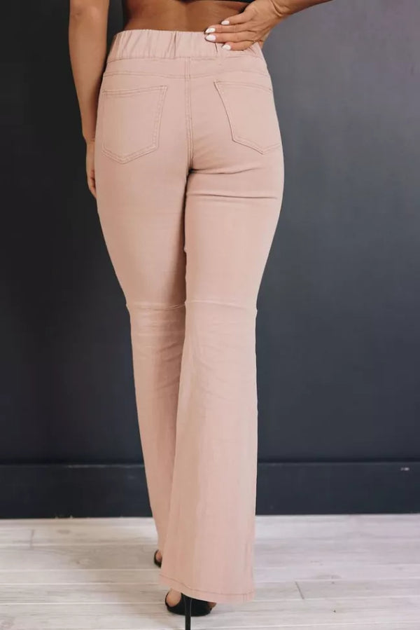 Light beige high-rise flare jeans with front pockets and stitched seams