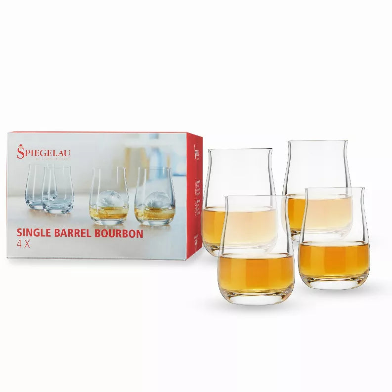 Set of four clear glass bourbon tumblers, each holding amber whiskey; includes retail box.