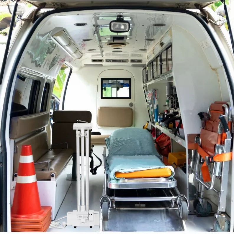 Tabletop UVC sterilizer unit with vertical lamp tubes and base on van floor