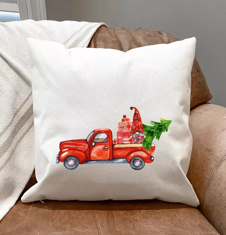 White pillow cover with red truck and green tree graphic