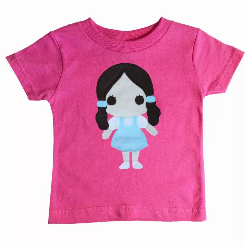 Pink kids T-shirt featuring a Dorothy character print at center front
