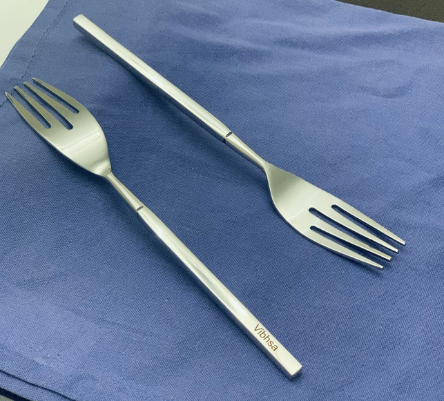 Vibhsa stainless steel dinner forks, polished with 4 tines, close-up of handles