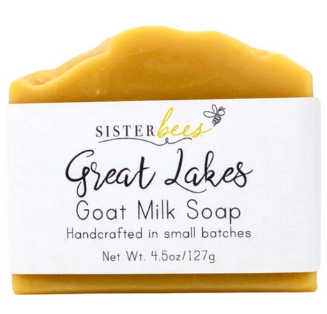 Yellow 4.5 oz goat milk soap bar with white label wrapper