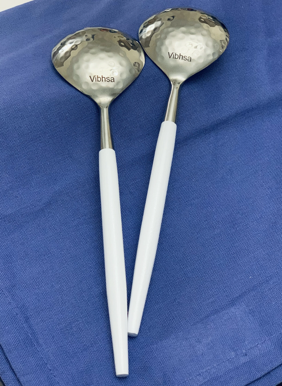Vibhsa hammered-mouth serving spoons with white handles, set of 2 shown