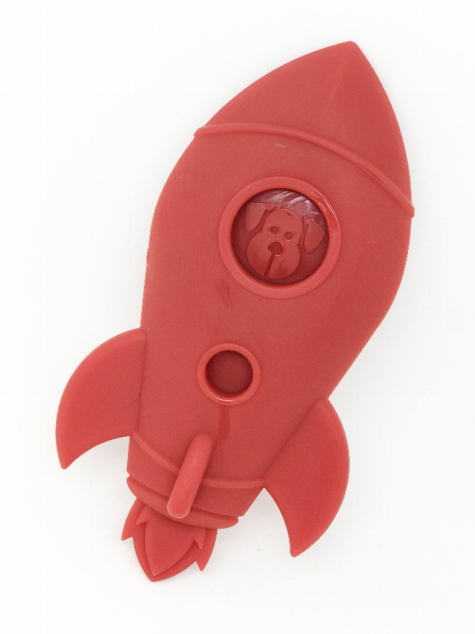 Red rocket-shaped dog chew toy shown at an angle, with round window and fins