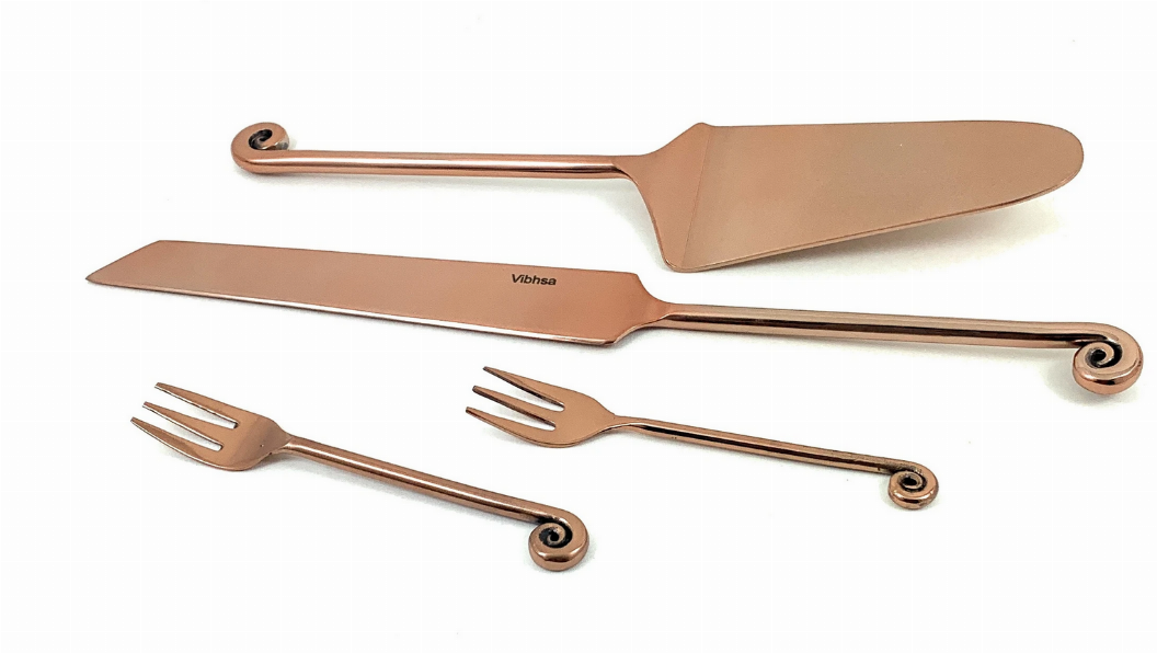 Vibhsa rose-gold cake server, knife and two cake forks with treble-note handles