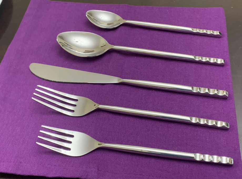 5-piece silver flatware place setting with spoons, forks, and knife