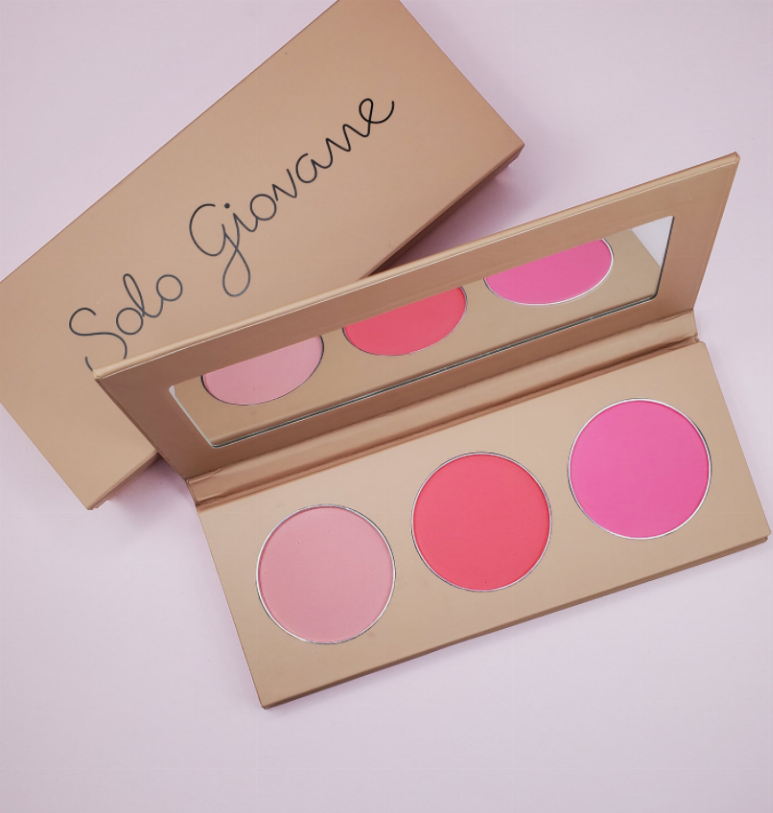Three-pan blush palette with three pink shades in an open cardboard case