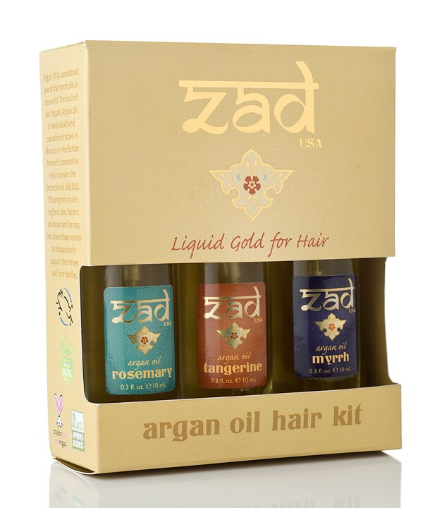 Argan oil hair kit in cardboard box with three small bottles (blue, amber, dark blue).