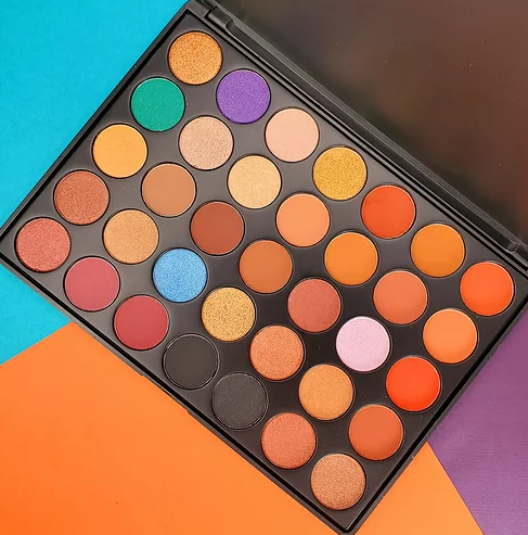 High-pigment eyeshadow palette with assorted multicolor shades in round pans